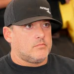 Tony-Stewart-looks-on-during-a-driver-meeting-during-the-Camping-World-Superstar-Racing-Experience-at-Nashville-Fairgrounds-Speedway-on-July-09-2022